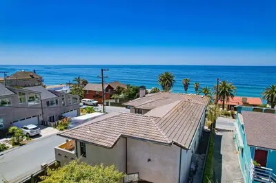an aerial view of a house and the ocean at Ocean Oasis in Encinitas