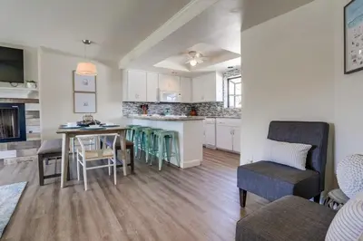 a kitchen and living room with a table and chairs at Pacific Shores in San Diego