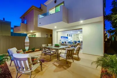 a patio with a table and chairs in a house at CA Dreaming in San Diego