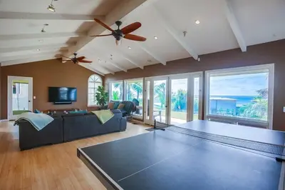 a living room with a couch and a table at GrandView in Encinitas