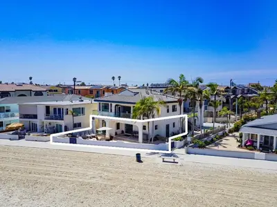 an aerial view of houses on the beach at Point Break 1 in San Diego