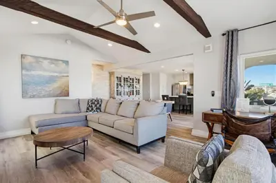 a living room with a couch and a table at Point Break 1 in San Diego