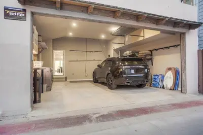 a garage with a car parked inside of it at Reef Break 1 in San Diego