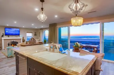a large kitchen with a view of the ocean at Reef Break 1 in San Diego