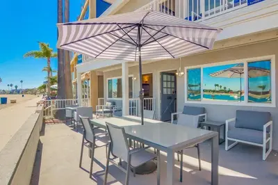a table and chairs with an umbrella on a patio at Bayside 2 in San Diego