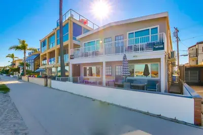 a building on the beach next to a street at Bayside 2 in San Diego