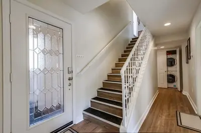 a staircase in a home with a glass door at Island Style in San Diego