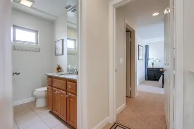 a bathroom with a sink and a toilet in it at Island Style in San Diego