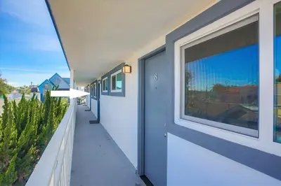 a hallway of a house with a large window at Strandway Suite 6 in San Diego
