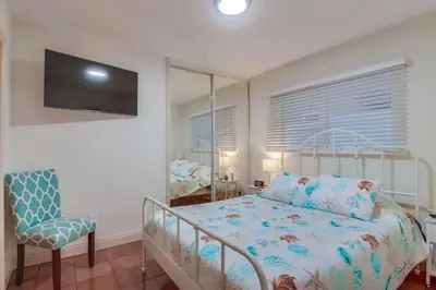 a bedroom with a bed and a chair at Marina 2 in San Diego