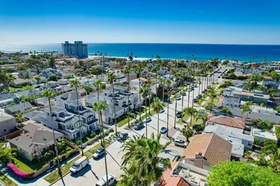 an aerial view of a city with the ocean at North Shore in San Diego