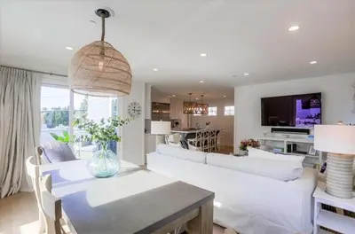 a living room with a white couch and a table at The Shores 4 in San Diego