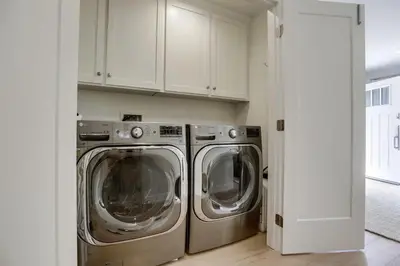 a kitchen with two washing machines in a room at The Shores 4 in San Diego