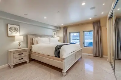 a bedroom with a large bed and a window at Residence Club 3 in San Diego