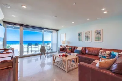 a living room with a couch and a table at Residence Club 3 in San Diego