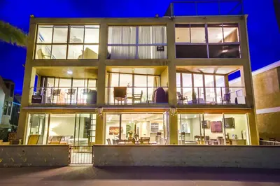 a house with large glass doors and a lot of windows at Waterfront 2 in San Diego