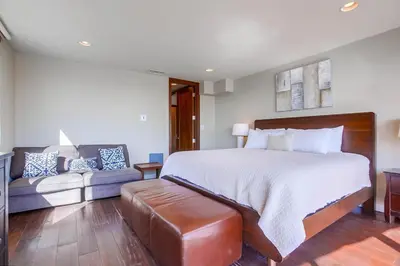 a bedroom with a large bed and a couch at Waterfront 2 in San Diego
