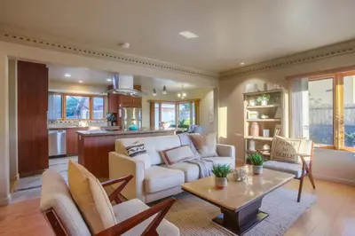 a living room with a couch and a table at Windansea 1 in San Diego