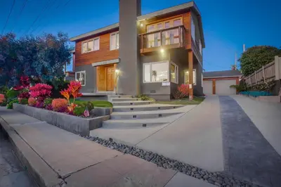 a house with stairs in front of it at Windansea 1 in San Diego