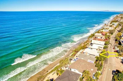 an aerial view of a beach with houses and the ocean at Sunset Beach in Encinitas