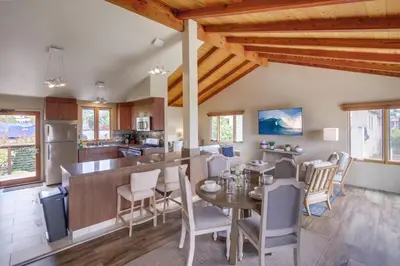 a kitchen and dining room with a table and chairs at Windansea 2 in San Diego