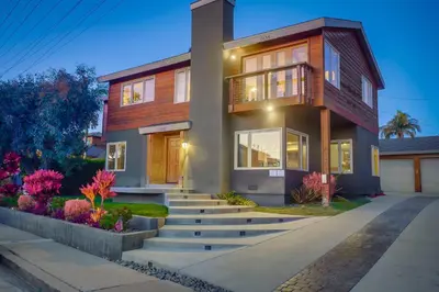 a house with a staircase in front of it at Windansea 2 in San Diego