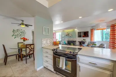 a kitchen with a stove and a table in it at Beach Haven 1 in San Diego