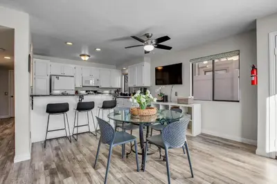 a kitchen and dining room with a table and chairs at Beach Style 2 in San Diego
