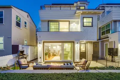 a large white house with a patio in front of it at Cali Vibes in San Diego
