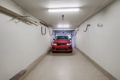 a red car is parked in a garage at Jamaica Sands WINTER SPECIAL! in San Diego