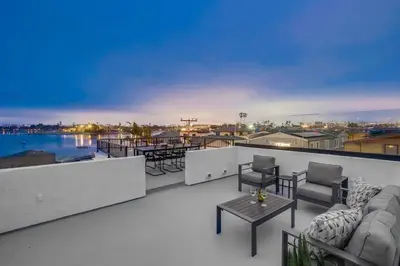 a balcony with furniture and a view of the water at Kennebeck Cove in San Diego
