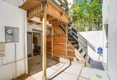 a building with a wooden staircase in the side of a house at Kettner Row 1 in San Diego
