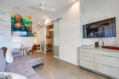 a bedroom with a bed and a desk and a tv at Kettner Row 1 in San Diego