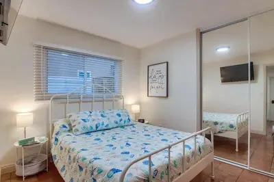 a bedroom with a bed in a room with a window at Marina 1 in San Diego