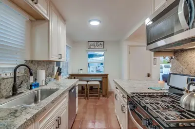 a kitchen with a sink and a stove top oven at Marina 1 in San Diego