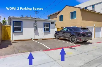 a car parked in a parking lot next to a building at Marina 1 in San Diego
