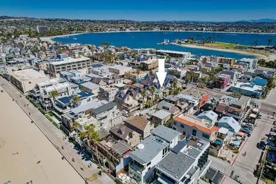 an aerial view of a city with a beach and buildings at Palms Paradise 1 in San Diego