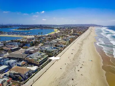 an aerial view of a beach with buildings and the ocean at Residence Club 1 in San Diego