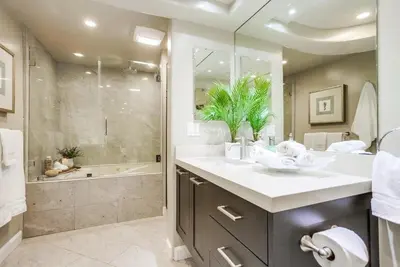 a bathroom with a sink and a shower and a tub at Residence Club 1 in San Diego