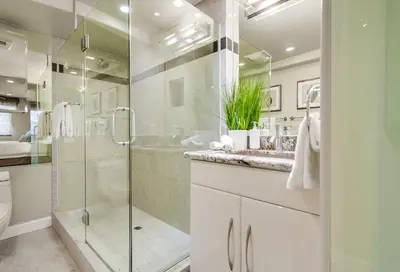 a bathroom with a glass shower and a sink at Residence Club 1 in San Diego