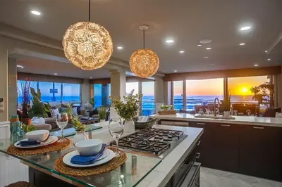 a kitchen with a stove and a view of the ocean at Residence Club 1 in San Diego