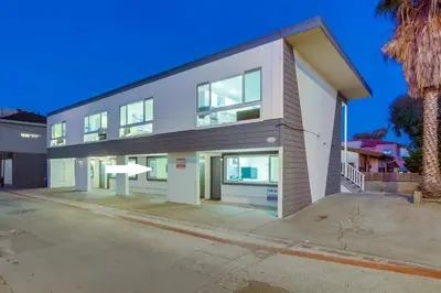 a large white building with a lot of windows at Strandway Suite 2 in San Diego