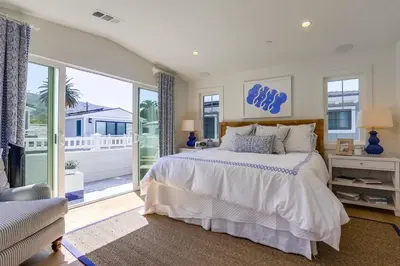 a bedroom with a bed and a large window at The Shores 2 in San Diego