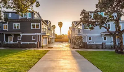 a driveway in front of two large houses at The Shores 2 in San Diego