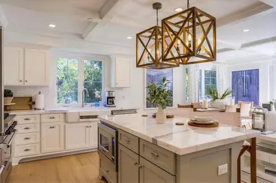a large kitchen with a chandelier and a large island at The Shores 2 in San Diego