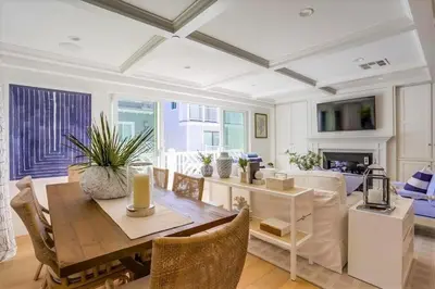 a dining room with a table and a living room at The Shores 2 in San Diego