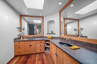 a large kitchen with a sink and two mirrors at Stunning Ocean-View Villa, Walking to La Jolla Cove in San Diego