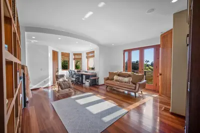 a living room with a couch and a table at Stunning Ocean-View Villa, Walking to La Jolla Cove in San Diego