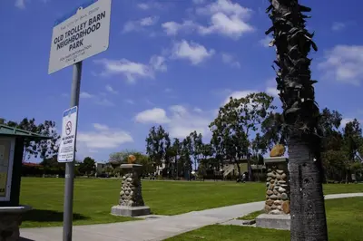 a sign in front of a park with a tree at Casa Nova - Central San Diego FREE parking in San Diego
