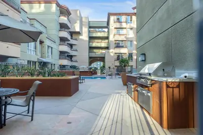 an outdoor patio with an outdoor kitchen on a building at San Diego's Diamond in San Diego